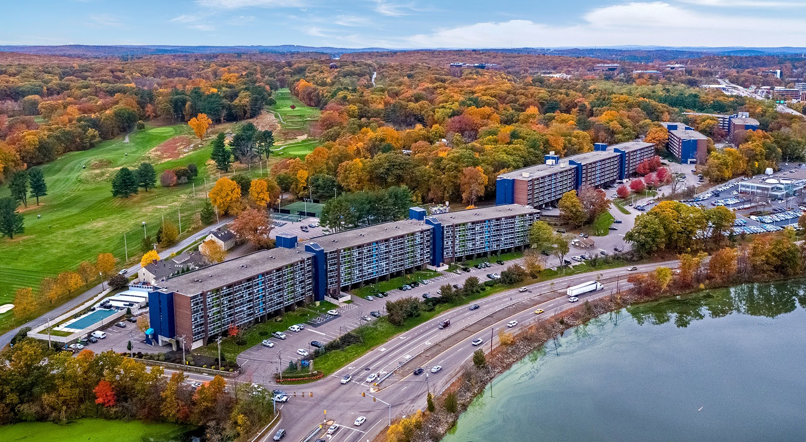 Aerial view of The Green at 9&90 beside the reservoir and golf course