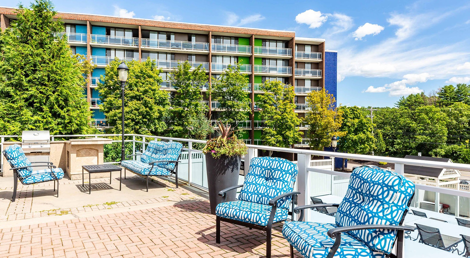 Terrace and multifamily building at The Green at 9&90